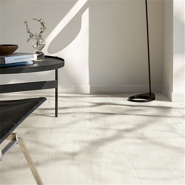 grey matching skirtings to a grey laminate floor